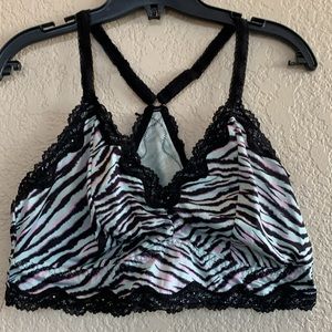 Torrid bralette print purple w/ roses/skulls or blk,mint and pink tiger stripe.